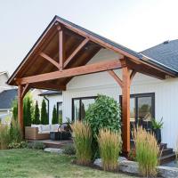 A Timber-Frame Porch That Extends the Way a Home Is Lived